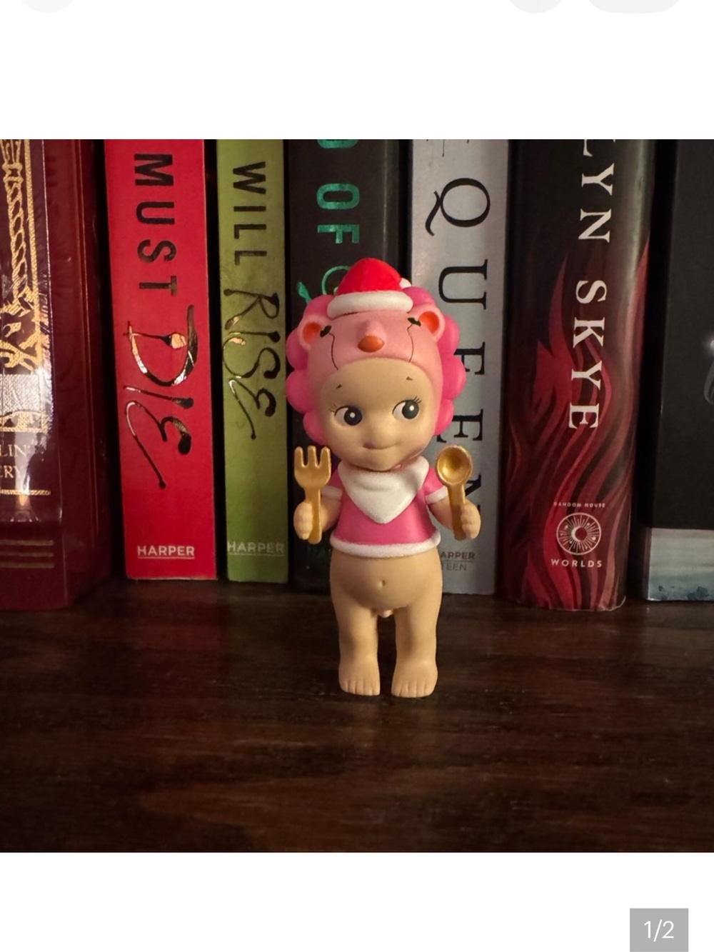 Pink Lion and flower sonny angel held for